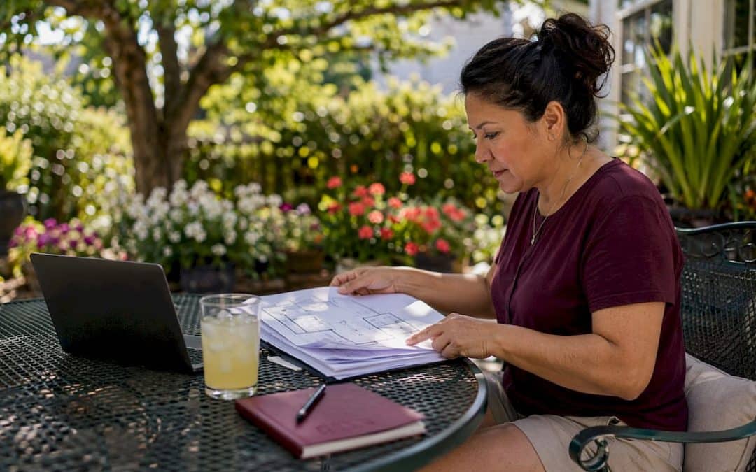 Woman reviewing home equity loan documents at kitchen table