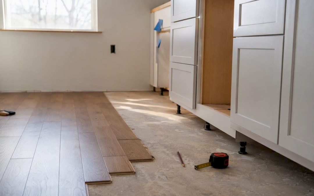 Close-up of flooring and cabinets during kitchen renovation