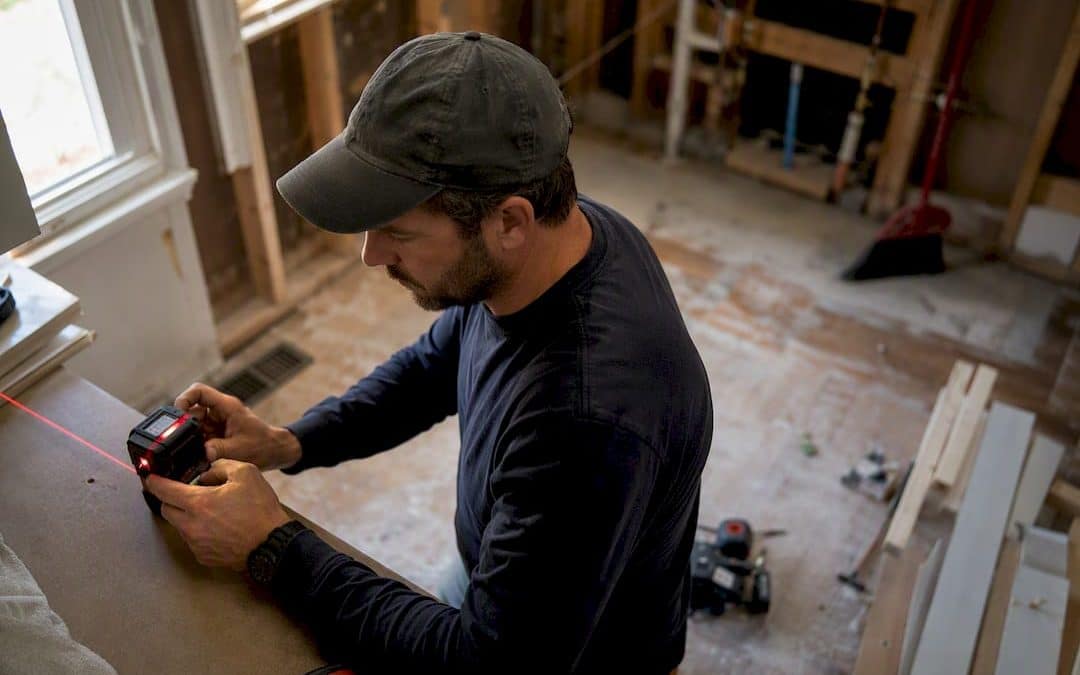 Contractor measuring in kitchen remodel