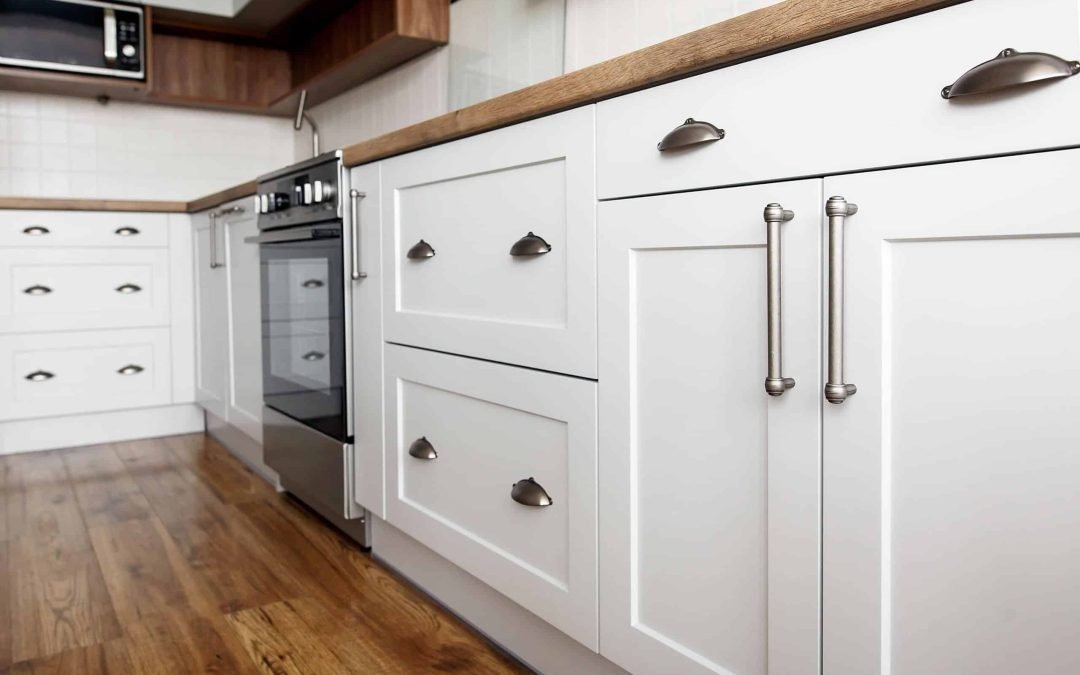 add hardware to kitchen cabinets