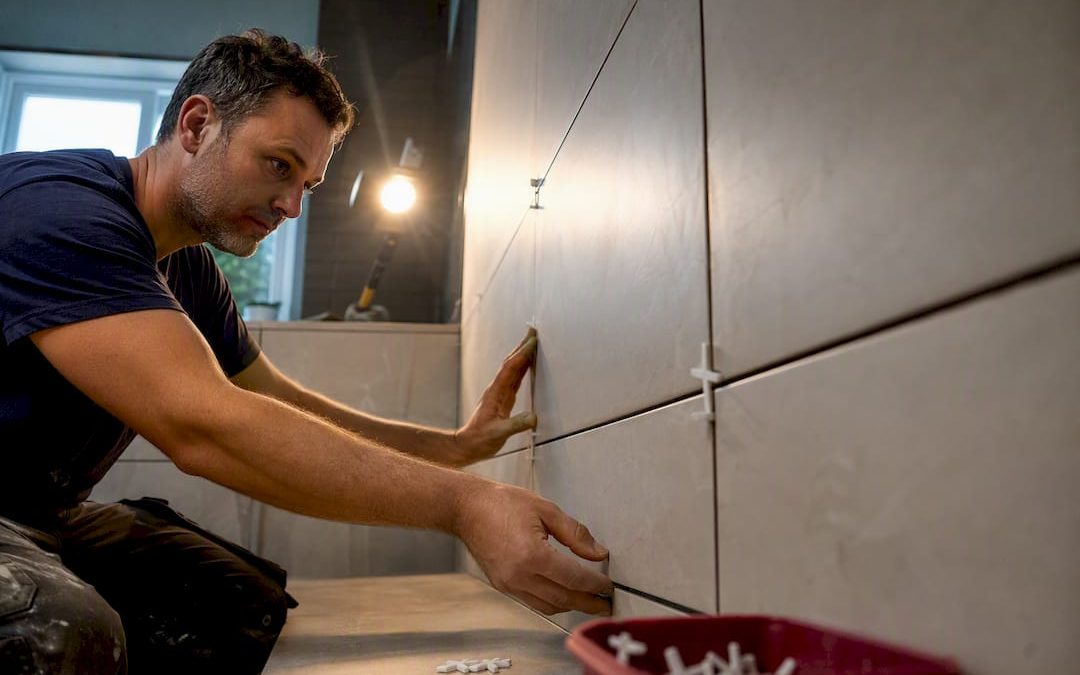 Tile spacers defining visible grout joints