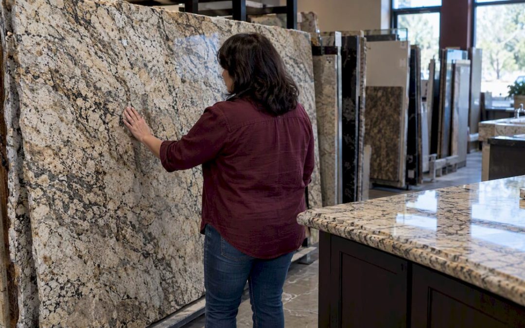 Homeowner comparing granite countertop slabs